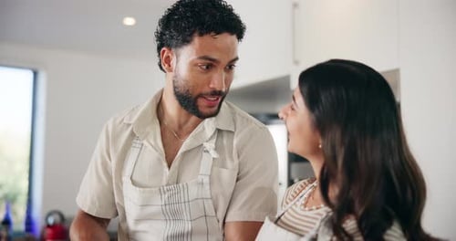 Happy Couple Preparing Food Together in Kitchen