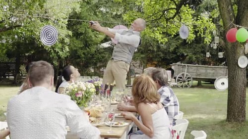 Family Celebration or a Garden Party Outside in the Backyard