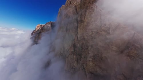Sunlight Highlighting Dramatic Rocky Landscape Casting Shadows Across Weathered Mountain Peaks with
