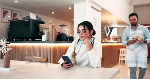 Woman Receives Coffee from Server at Cafe