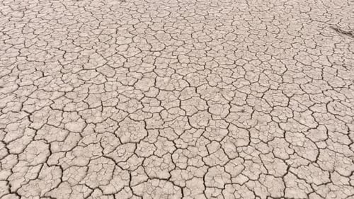 Aerial of the cracked surface of a dry lake