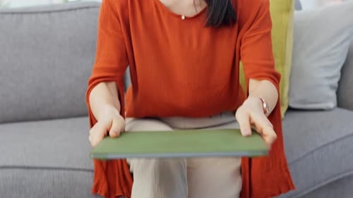 Woman Using Laptop on Couch at Home