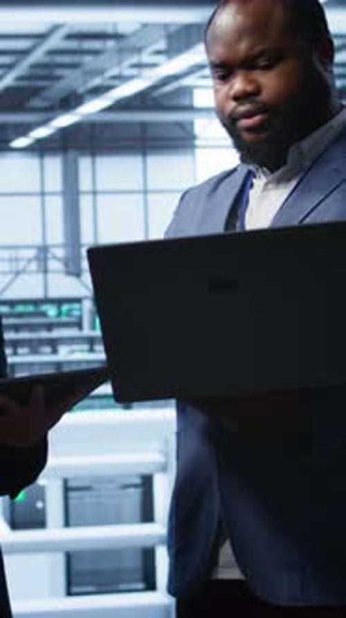 Vertical Video Team of Admins in Server Hub Workplace Monitoring Supercomputers