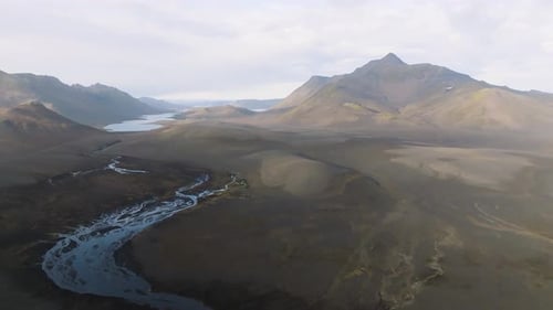 Aerial view of volcanic mountains and river, Iceland.