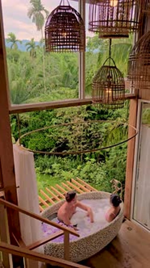 Romantic Couple Relaxing in Tropical Bathtub