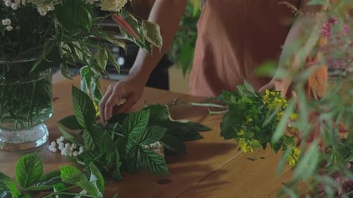 Flower Shop Florist Hands Creating Bouquet of Fresh Summer Flowers