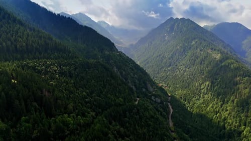 Vast green valley, mountain encircled.