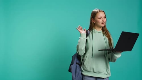 Woman with Laptop Talking on Video Call