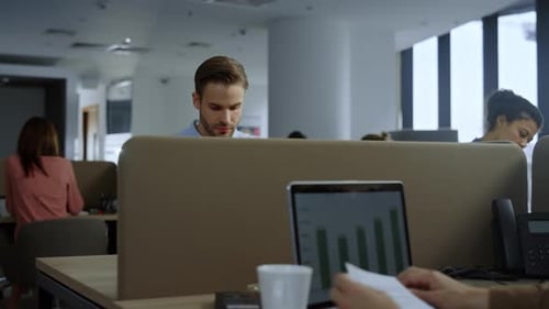 Happy Businessman Reading Good News on Laptop Screen in Office. Smiling Manager