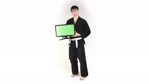Young Adult Holding Green Screen Monitor in Gi