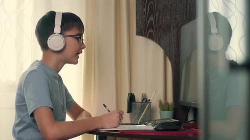 Teen Student Learning with Computer at Home