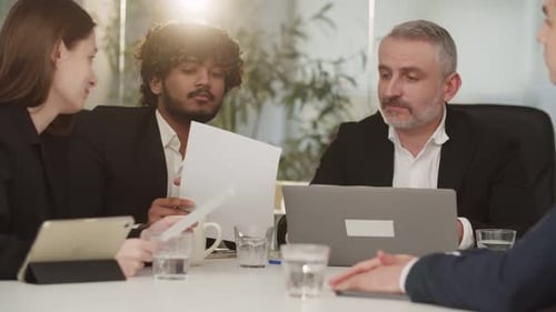 Diverse Professionals Collaborate in Business Meeting