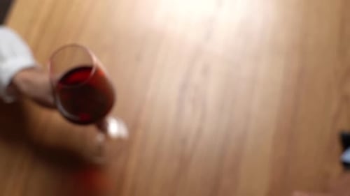 Closeup Top View of Unrecognizable Happy Couple Clinking Wine Glasses Enjoying Nice Romantic Dinner