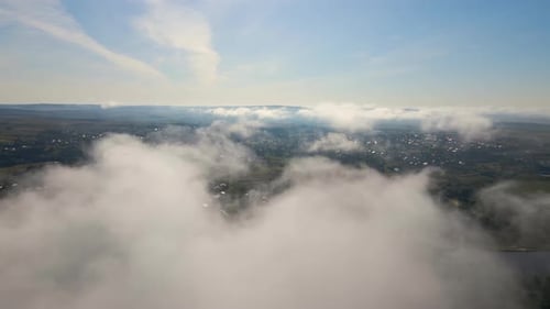 Top View From Above of Landscape Covered with Puffy Morning Fog Cold Humid Air Condensing in Rain