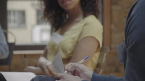 Male taking notes during group workshop