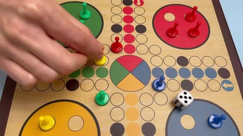People Play Ludo or Pachisi Board Game on Beautiful Wooden Play Board Ludo is Strategy Board Game