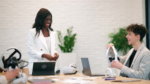 Female team leader at business conference in VR in an office. Multiracial group of people using VR g