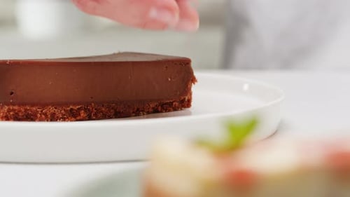 Decorating Delicious Chocolate Dessert With Blueberries