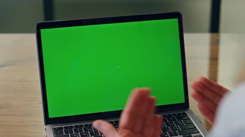 Woman Uses Laptop with Green Screen for Chroma Key