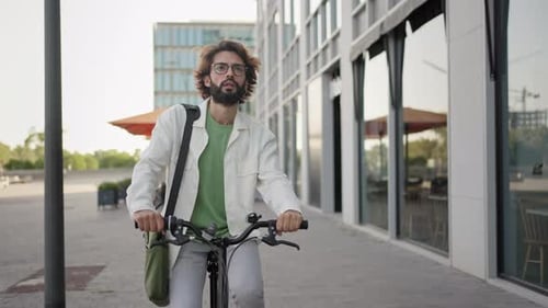 Young Professional Man Riding Bicycle in the City Going to Work Healthy Lifestyle and Sustainable