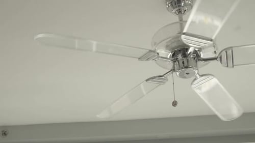 Ceiling Fan with Clear Blades Rotating Slowly