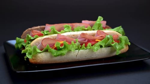 Fresh Ham and Lettuce Sandwich on Black Plate