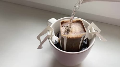 Making Drip Coffee in White Mug at Home
