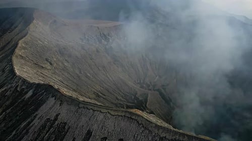 Man Stands Cliff Volcano Crater Drone View