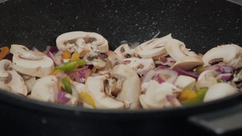 Diced Vegetables Sauteing in a Pan, Close Up