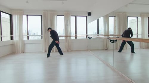Dancer Practicing in a Bright Urban Studio