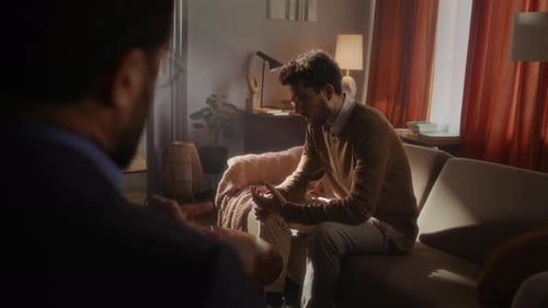 Male Talking to Therapist on Couch