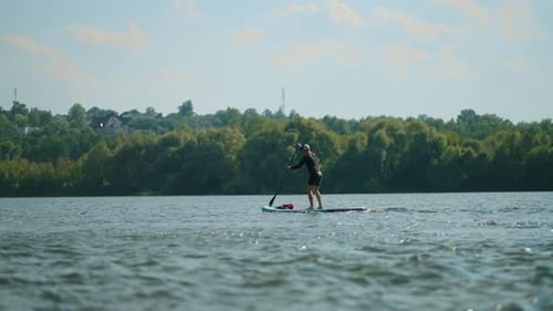 Athletic Man Rafting On Standup Paddleboard In River Active Leisure Outdoor In Summer Vacation