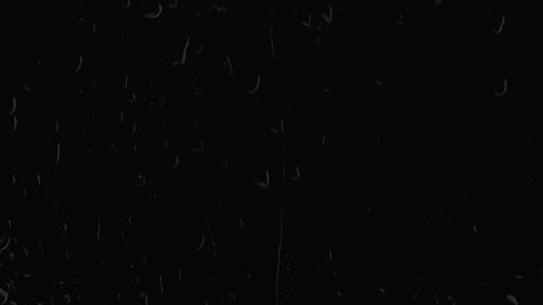 Large Droplets of Rain on Black Screen Overlay