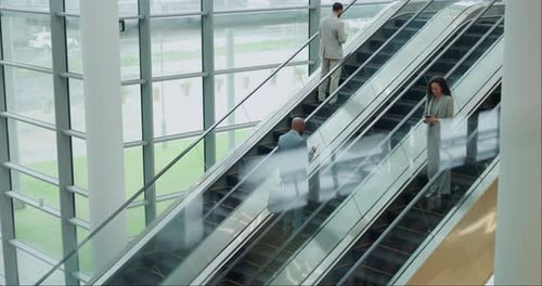 Escalator, office and business people on commute, travel and arrival for corporate career