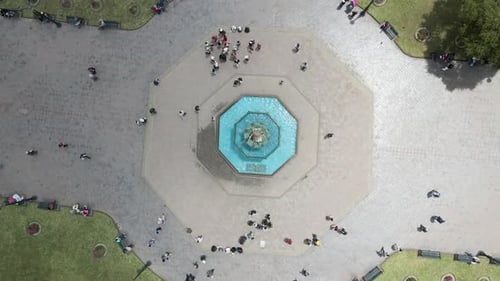 4K Aerial Drone Top Down Rise and Rotate over fountain at city square