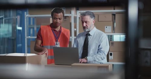Delivery Department Teamwork Caucasian and African Male Executives Wearing Uniform Speaking About