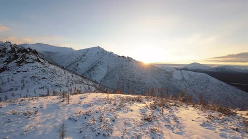 Snowy Mountains at Sunrise Aerial View