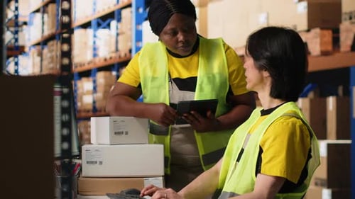 Depot Coworkers Processing Orders and Preparing the Packages Together