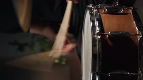 Person Playing Drum Kit Up Close