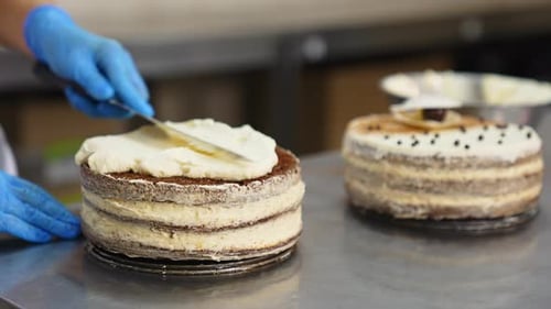 Chef Frosting Layered Cake With Spatula