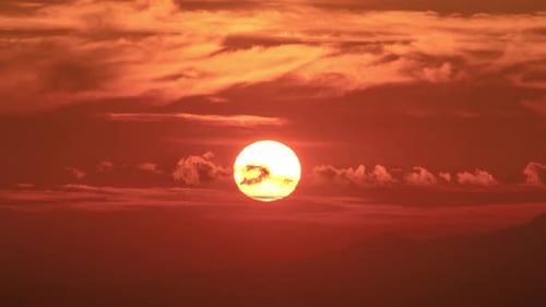 Fiery Sunset Sky with Mountain Silhouette