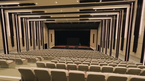 Big empty auditorium with comfortable leather seats,Modern interior.Motion camera. 4K