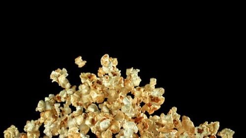 Slow Motion Popcorn Floating on Black Background for Compositing