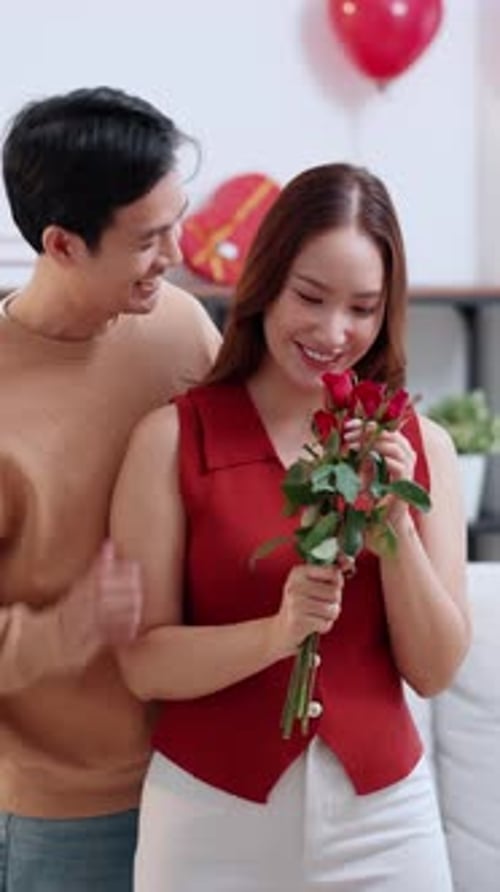 Loving Man Gives Beautiful Roses to Woman