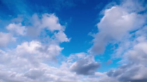 Timelapse of Cumulus Clouds Moves In The Blue Sky