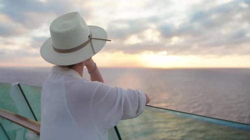 Woman Enjoys Sunset on Ocean Cruise Ship