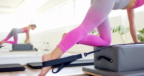 Woman Doing Pilates Leg Workout in Studio