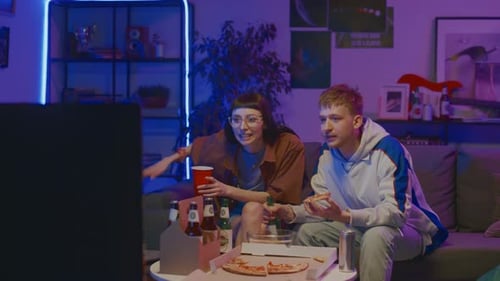 Friends Watch TV, Eat Pizza, and Drink Beer