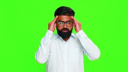 Indian Man Touching Temples with Fingers Showing Headache Pain or Mental Overload Stress Chroma Key