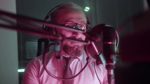 Podcast recording in red lightroom
